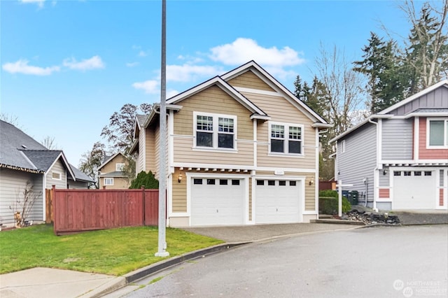 view of front facade featuring a garage and a front lawn