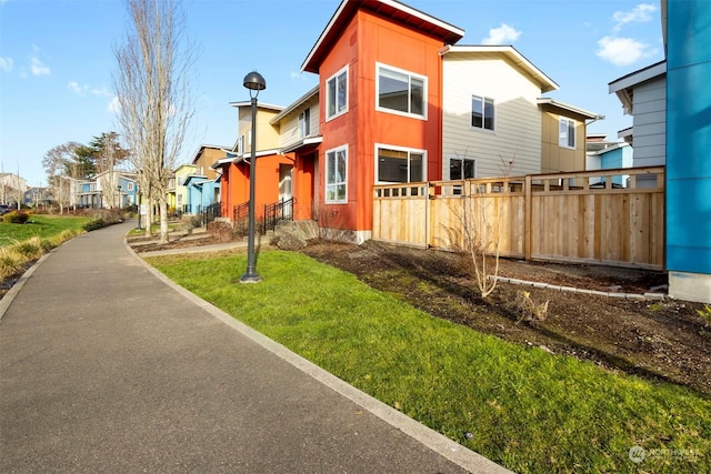 view of home's exterior with a lawn