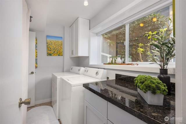 laundry area featuring cabinets and separate washer and dryer