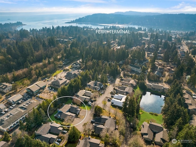 birds eye view of property featuring a water view