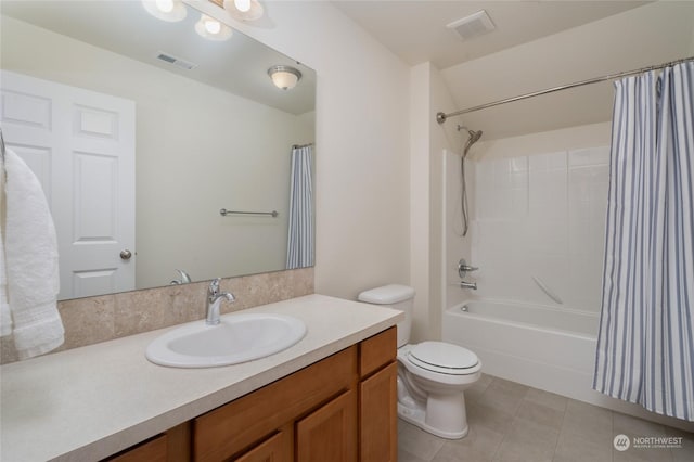 full bathroom with shower / tub combo, vanity, tile patterned flooring, and toilet