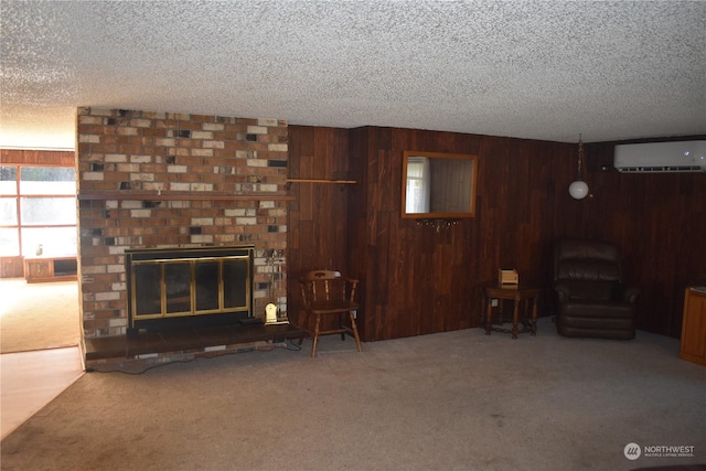 unfurnished living room featuring an AC wall unit, carpet, a fireplace, and wood walls