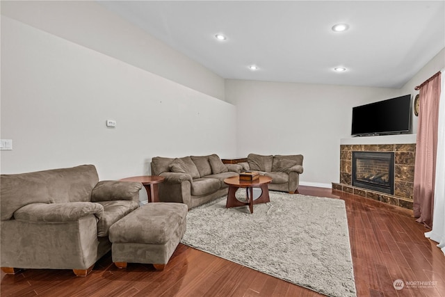 living room featuring dark hardwood / wood-style floors and a fireplace