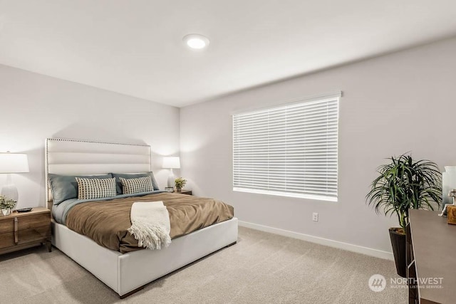 bedroom featuring light carpet