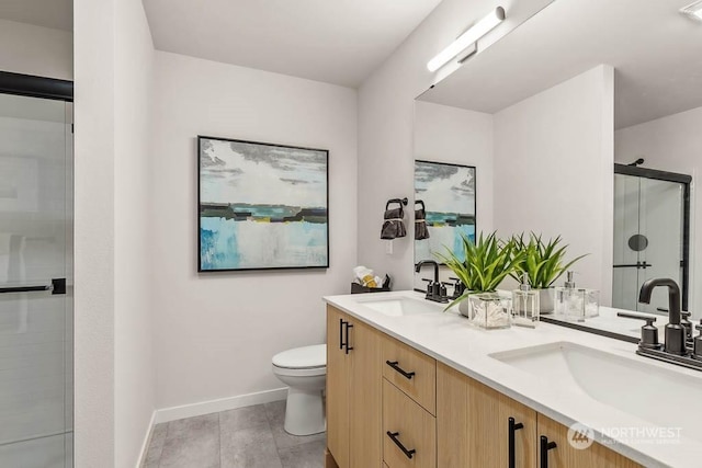 bathroom featuring vanity, tile patterned flooring, a shower with shower door, and toilet