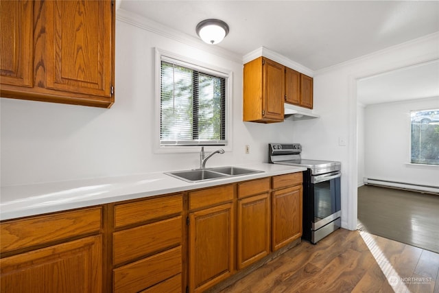 kitchen with sink, electric range, a wealth of natural light, and a baseboard heating unit