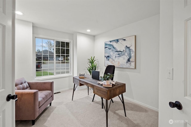 home office with light colored carpet