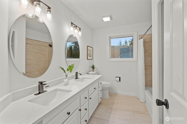 full bathroom featuring vanity, toilet, and shower / bath combo with shower curtain