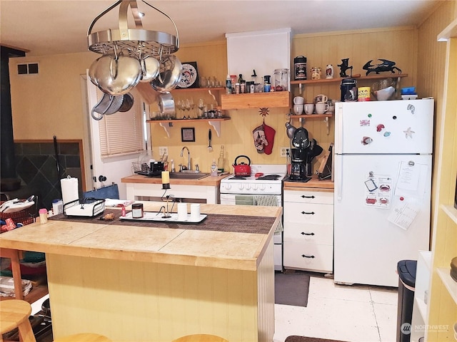 kitchen featuring sink and white appliances