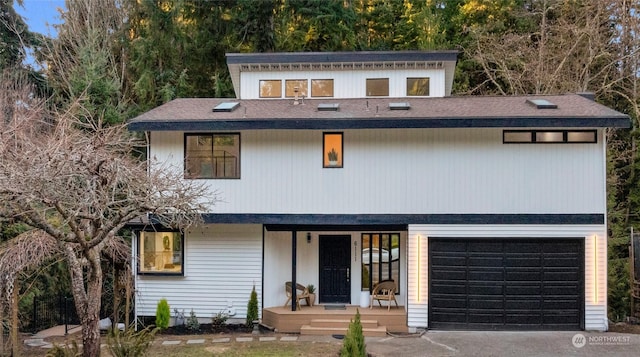 view of front facade featuring a garage and covered porch