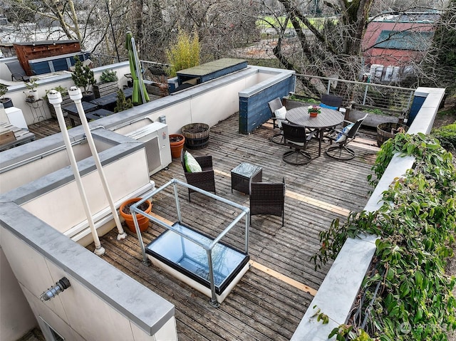 wooden terrace with an outdoor fire pit