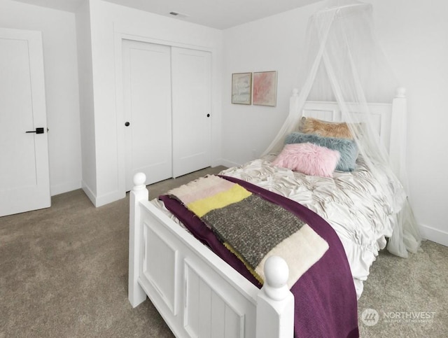 carpeted bedroom with a closet