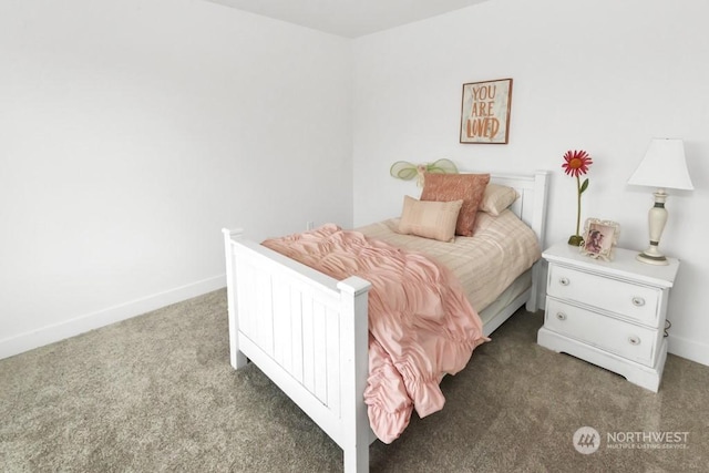 bedroom with dark colored carpet