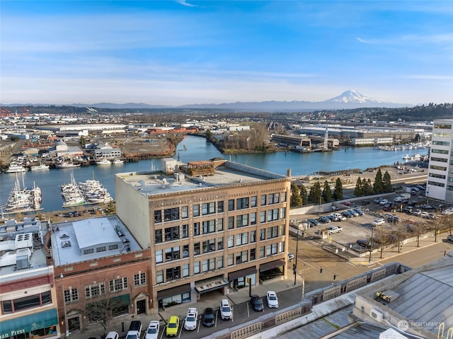 bird's eye view with a water and mountain view