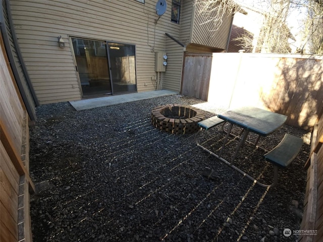 view of yard with an outdoor fire pit and a patio area