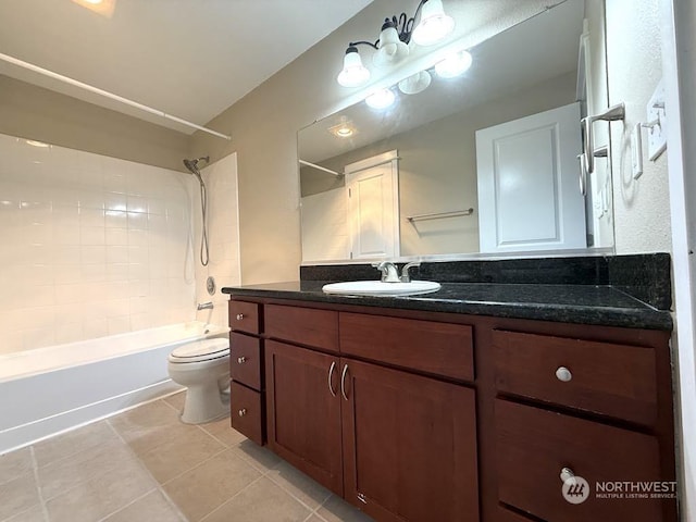 full bathroom with tiled shower / bath combo, vanity, tile patterned floors, and toilet