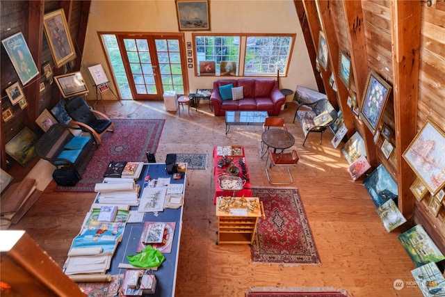 living room featuring french doors and a healthy amount of sunlight