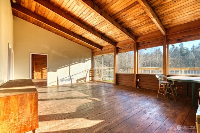 unfurnished sunroom with lofted ceiling with beams and wood ceiling