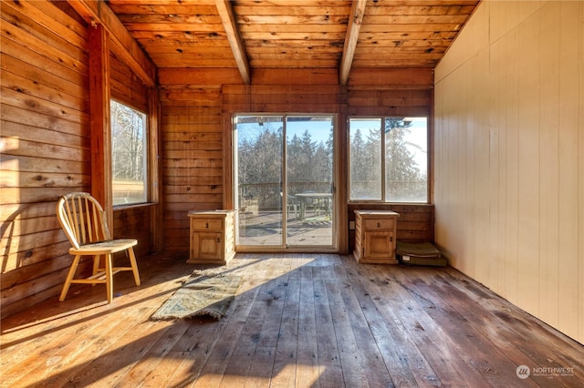 unfurnished sunroom with wood ceiling and vaulted ceiling with beams