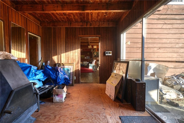 miscellaneous room with wood ceiling and wooden walls