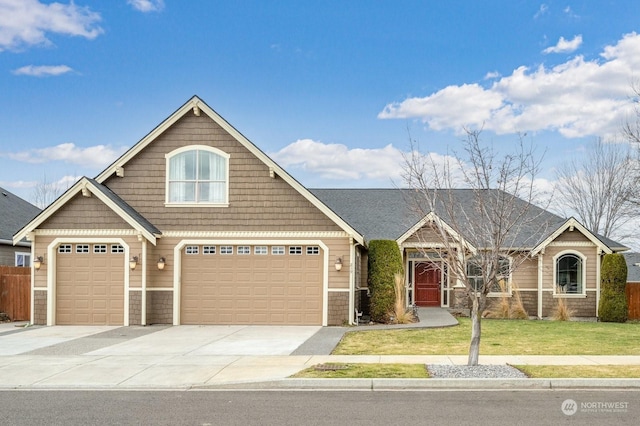 craftsman-style home featuring a garage and a front lawn