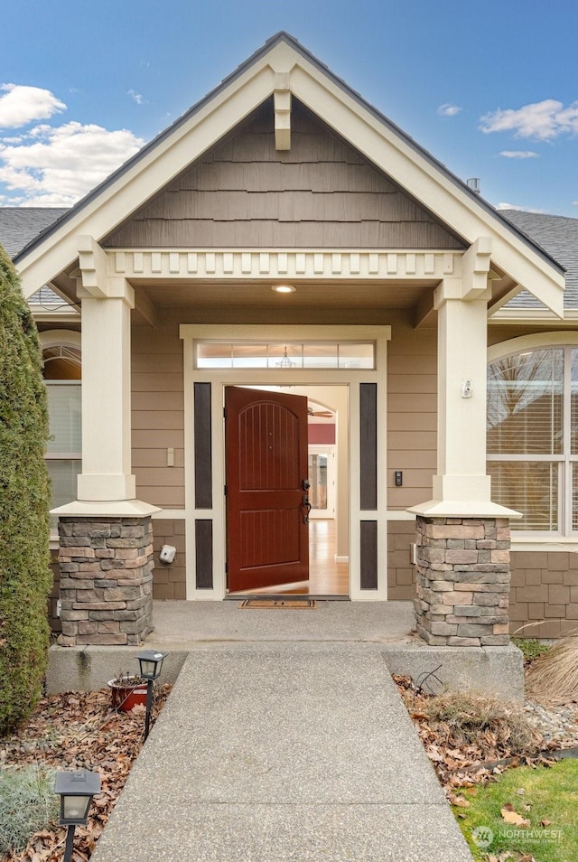 doorway to property featuring covered porch