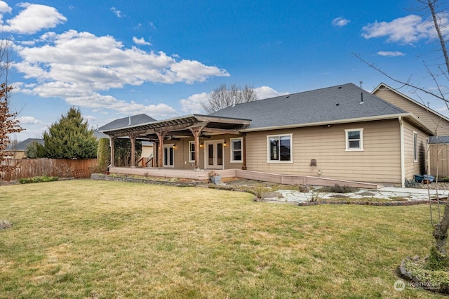 back of house featuring a yard, a pergola, and a patio area