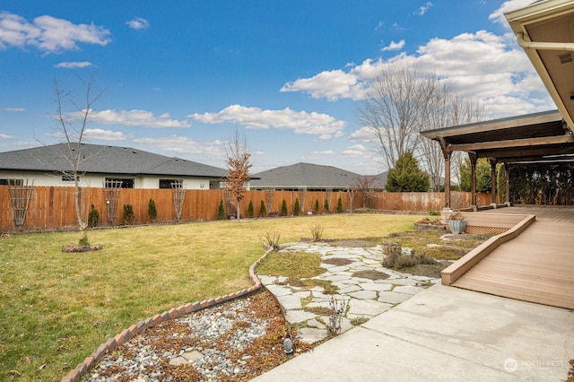 view of yard featuring a wooden deck