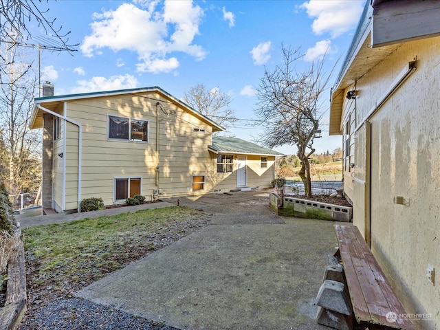 rear view of house with a patio