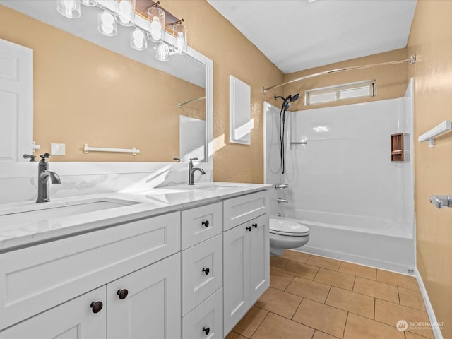 full bathroom featuring vanity, tile patterned floors, toilet, and washtub / shower combination