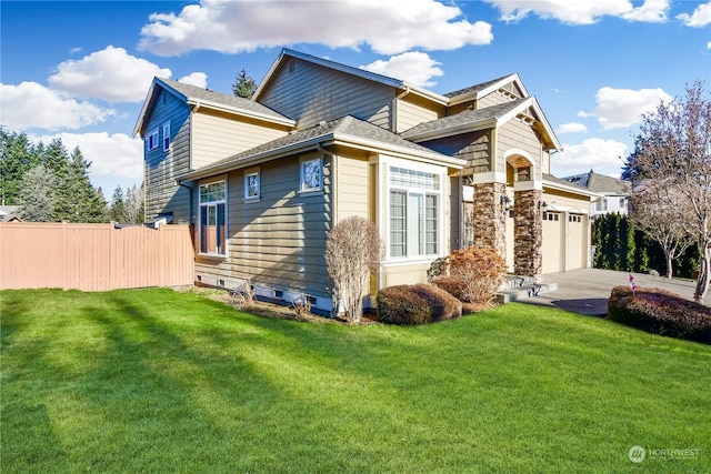 view of front of home featuring a garage and a front lawn