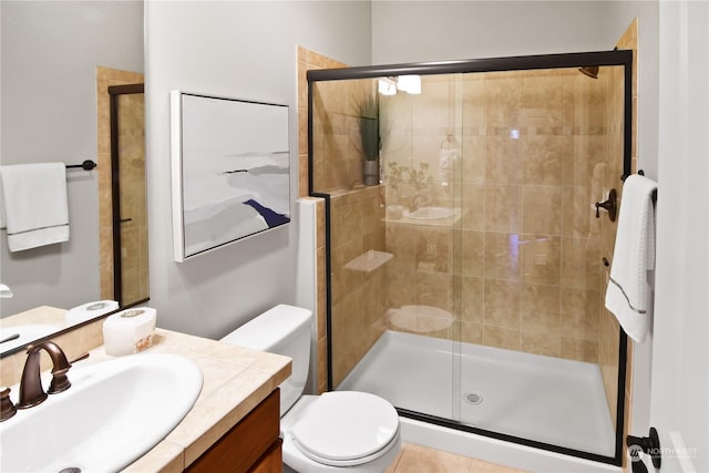 bathroom with vanity, toilet, and an enclosed shower