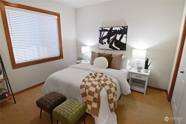 bedroom with light colored carpet