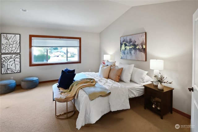 bedroom with lofted ceiling and carpet