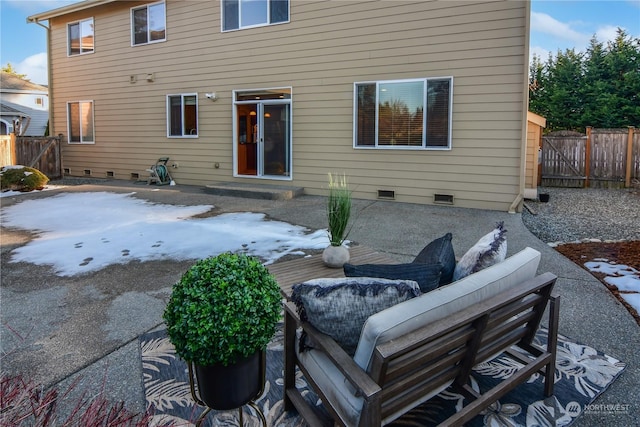 snow covered property featuring a patio