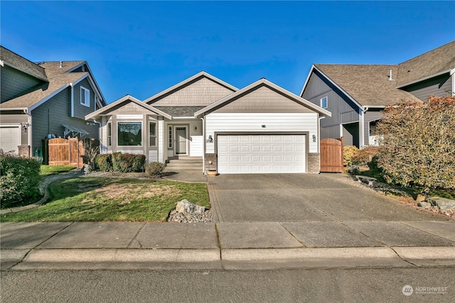 view of front of home with a garage and a front yard