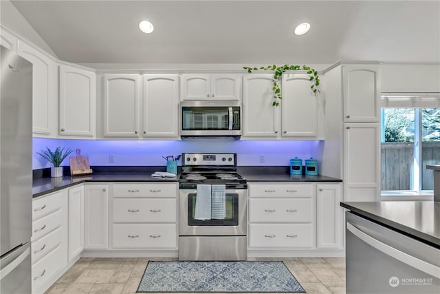 kitchen featuring stainless steel appliances and white cabinetry