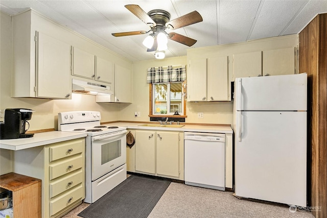 kitchen featuring ceiling fan, sink, white appliances, and cream cabinetry