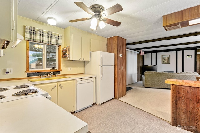 kitchen featuring light carpet, sink, white appliances, and ceiling fan