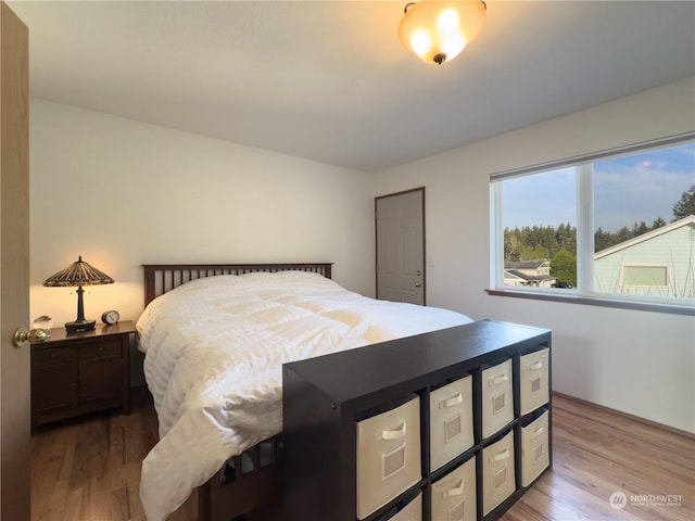 bedroom with light hardwood / wood-style floors