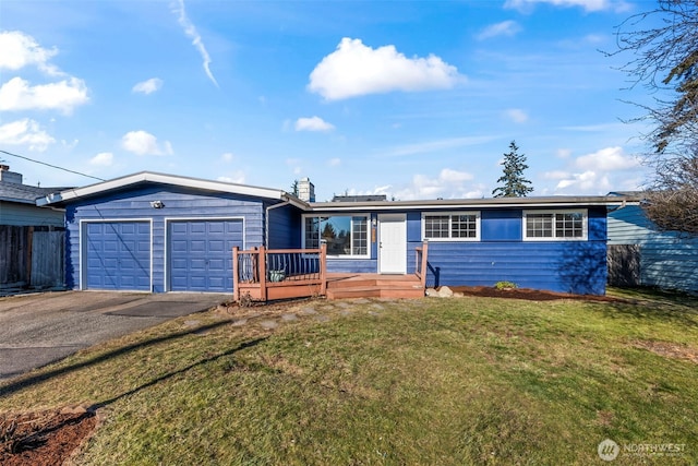 ranch-style home with a garage and a front yard