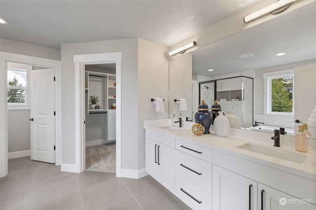 bathroom with vanity, tile patterned floors, and independent shower and bath