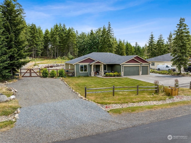 single story home featuring a garage and a front lawn