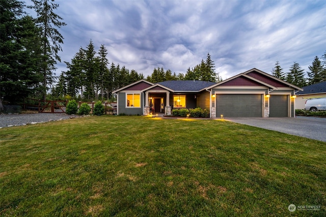 view of front of property featuring a garage and a front yard