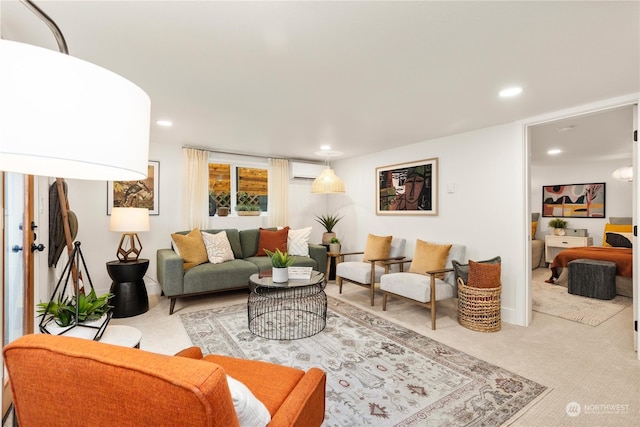 carpeted living room featuring an AC wall unit