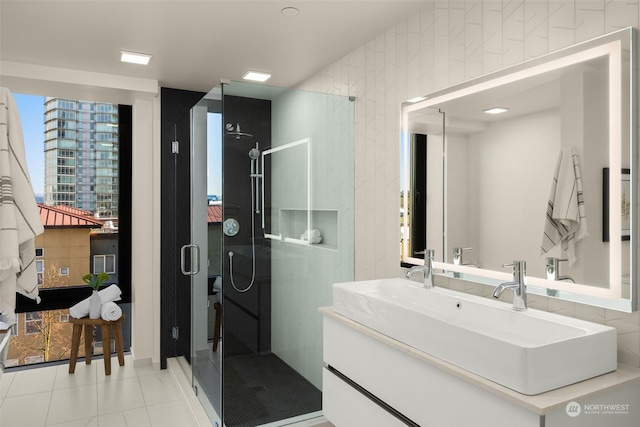 bathroom with an enclosed shower and vanity