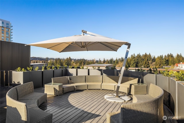 wooden terrace featuring an outdoor hangout area