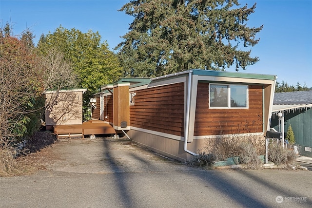 view of side of property featuring a deck