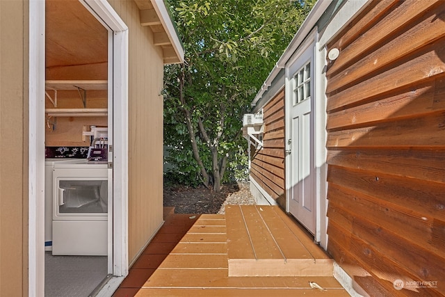 exterior space featuring independent washer and dryer