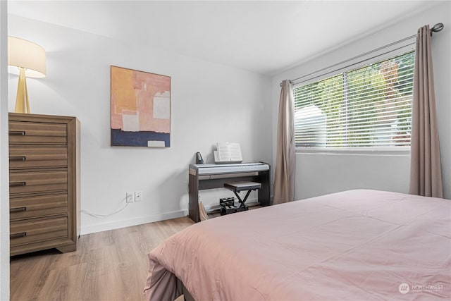 bedroom featuring light wood-type flooring